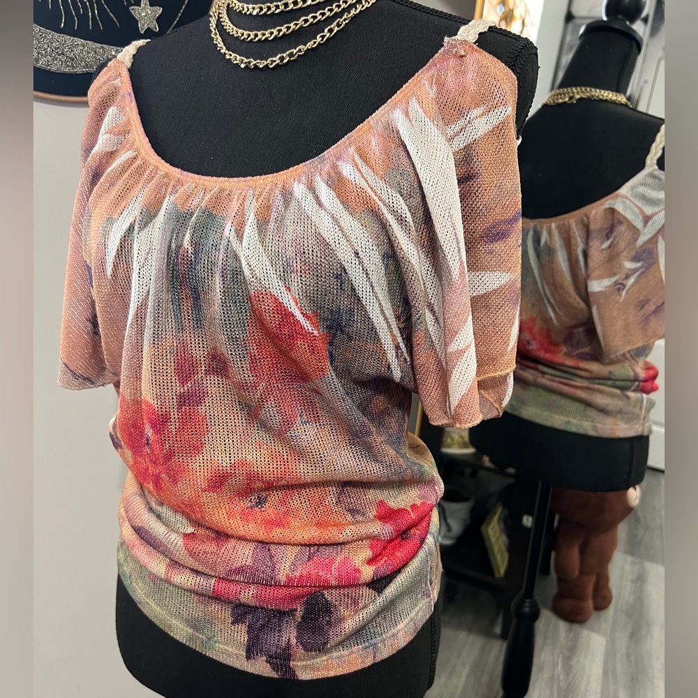 Floral off shoulder shirt.